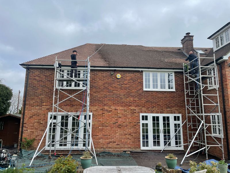 Roof cleaning carried out safely from scaffold towers by The Roof Moss Cleaners in Haywards Heath